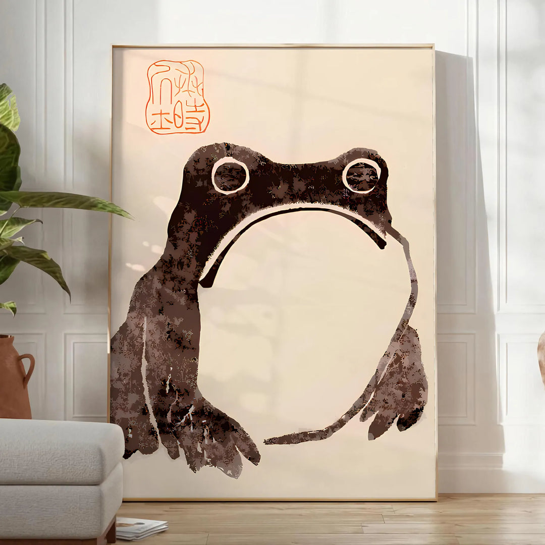 A frog with an unimpressed expression against a black and orange background - in a bright minimalist room with a plant and an armchair