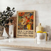 United States Navy travel poster featuring a ship in blue and red tones - styled on a counter with eucalyptus and a bowl of lemons