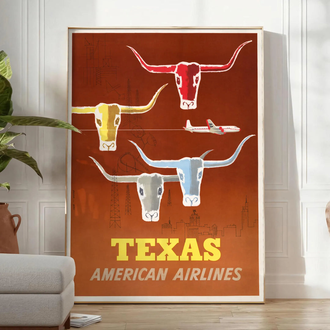 American Airlines travel poster featuring Texas with bold orange and yellow colors - in a bright minimalist room with a plant and an armchair