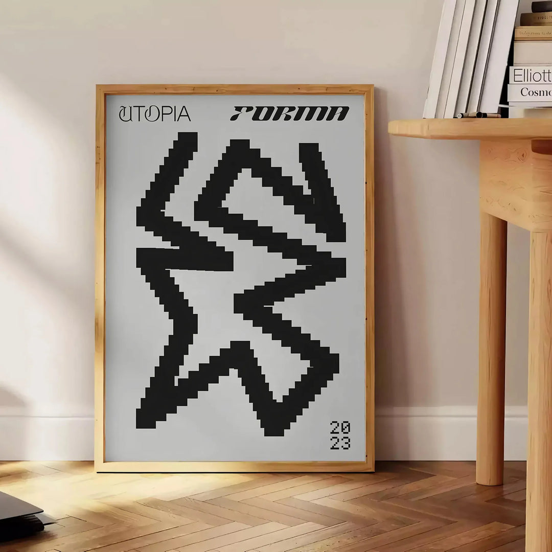 Composição abstrata com formas pretas e azuis representando uma utopia moderna - ao lado de uma mesa de apoio redonda em madeira com livros