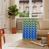 Abstract depiction of a serene utopia with green and blue tones - in a Parisian living room with a sofa and a fig plant