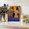 A travel poster featuring a serene landscape in green and blue hues - styled on a counter with eucalyptus and a bowl of lemons