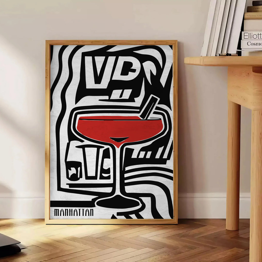 Abstract modern art with black and gray tones, evoking a sense of space - beside a round wooden side table with books