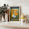 Vintage travel poster featuring the Venice Simplon train in rich browns and greens - styled on a counter with eucalyptus and a bowl of lemons