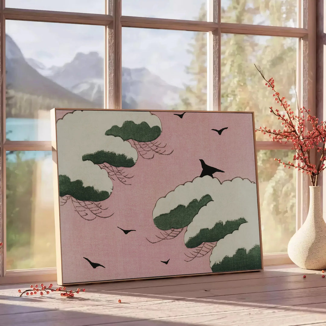 A vintage Japanese print featuring a bird in earthy tones of brown and green - beside a round wooden side table with books