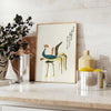 Illustration of a vintage Japanese bird in soft yellow and green tones - styled on a counter with eucalyptus and a bowl of lemons