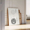 black and white vintage Japanese art featuring traditional motifs - leaning on a herringbone floor against a white panelled wall