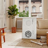 black and white vintage Japanese art featuring traditional motifs - in a Parisian living room with a sofa and a fig plant
