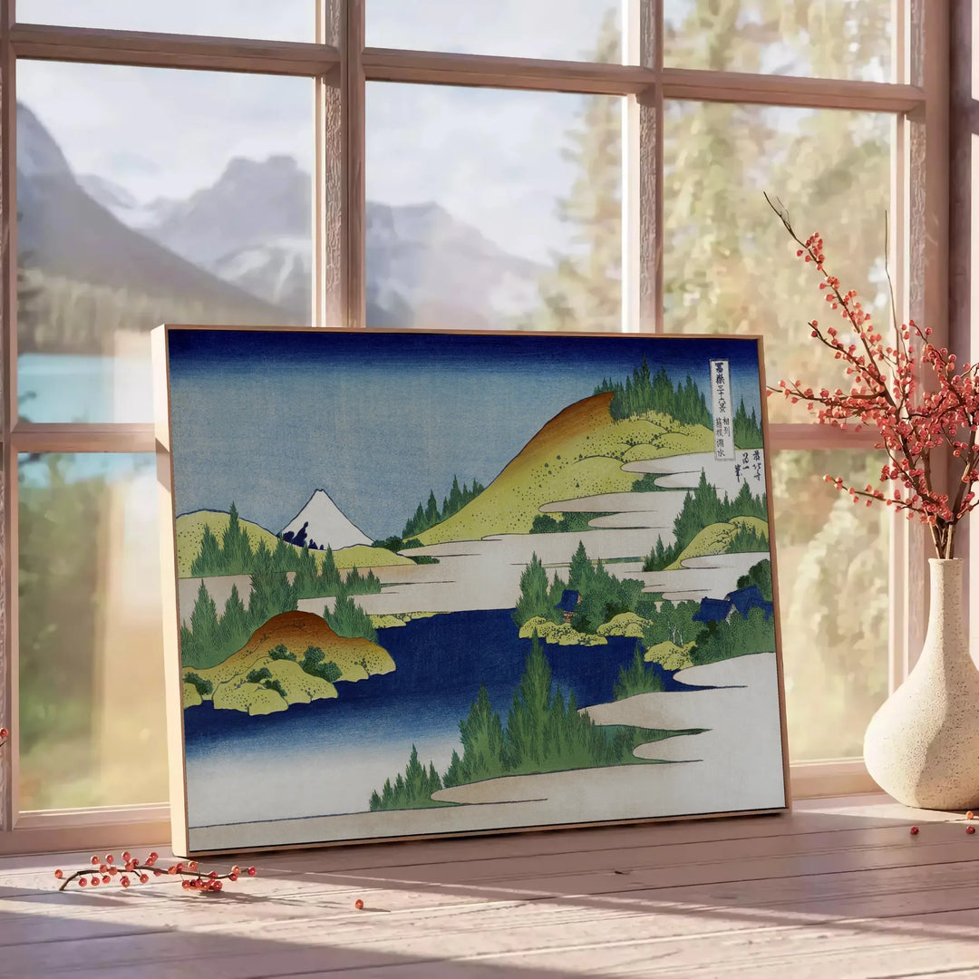 Vintage Japanese landscape with lush greenery and serene blue sky - beside a round wooden side table with books
