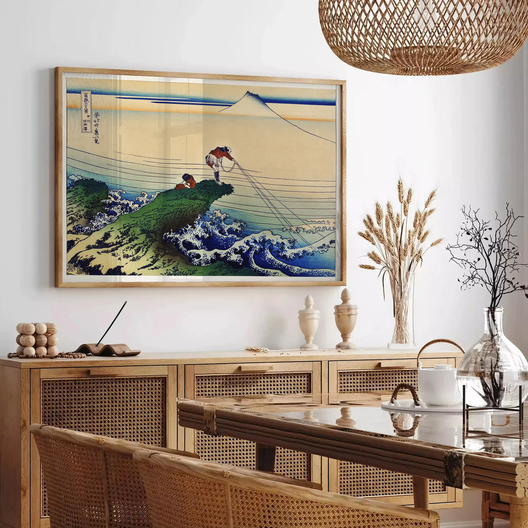 Vintage Japanese poster featuring earthy tones of brown and green - in a Parisian living room with a sofa and a fig plant