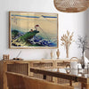 Vintage Japanese poster featuring earthy tones of brown and green - in a Parisian living room with a sofa and a fig plant