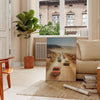 A vintage photograph featuring warm brown tones and serene green hues - in a Parisian living room with a sofa and a fig plant