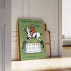 A vintage-style poster depicting rural life with muted gray and black tones - leaning on a herringbone floor against a white panelled wall