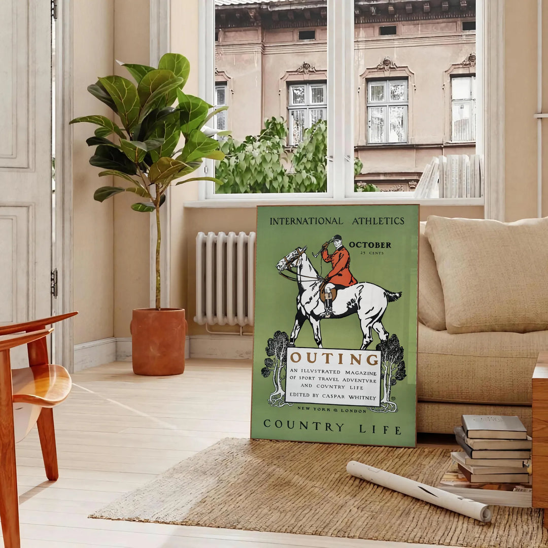 A vintage-style poster depicting rural life with muted gray and black tones - in a Parisian living room with a sofa and a fig plant