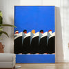 Vintage retro poster featuring bold black and orange tones - in a bright minimalist room with a plant and an armchair
