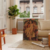 A vintage portrait of a South Asian woman in rich black and green tones - in a Parisian living room with a sofa and a fig plant