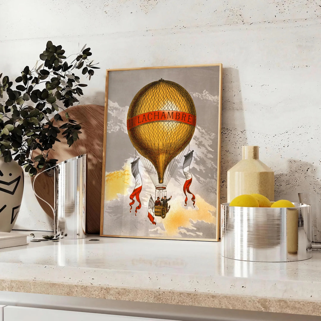 Vintage travel poster featuring Lachambre with earthy tones of brown and green - styled on a counter with eucalyptus and a bowl of lemons