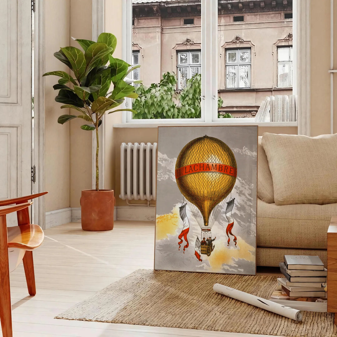 Vintage travel poster featuring Lachambre with earthy tones of brown and green - in a Parisian living room with a sofa and a fig plant