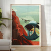 Abstract mountain landscape with black and orange hues - in a bright minimalist room with a plant and an armchair