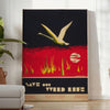 Vintage travel poster featuring bold black and orange colors - in a bright minimalist room with a plant and an armchair