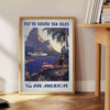 Vintage Pan American travel poster featuring retro airplane and muted gray-green tones - beside a round wooden side table with books