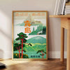 Vintage travel poster of Japan featuring serene green and blue tones - beside a round wooden side table with books