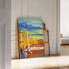 vintage poster of Queenstown featuring lush green landscapes and serene blue skies - leaning on a herringbone floor against a white panelled wall