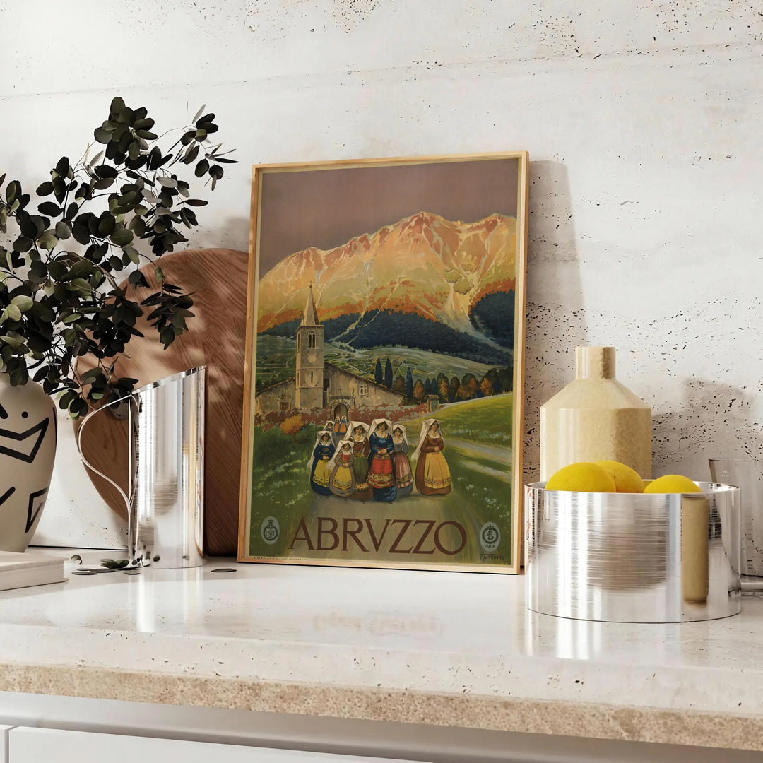 Stylized landscape of Abruzzo, Italy in muted black and green tones - styled on a counter with eucalyptus and a bowl of lemons