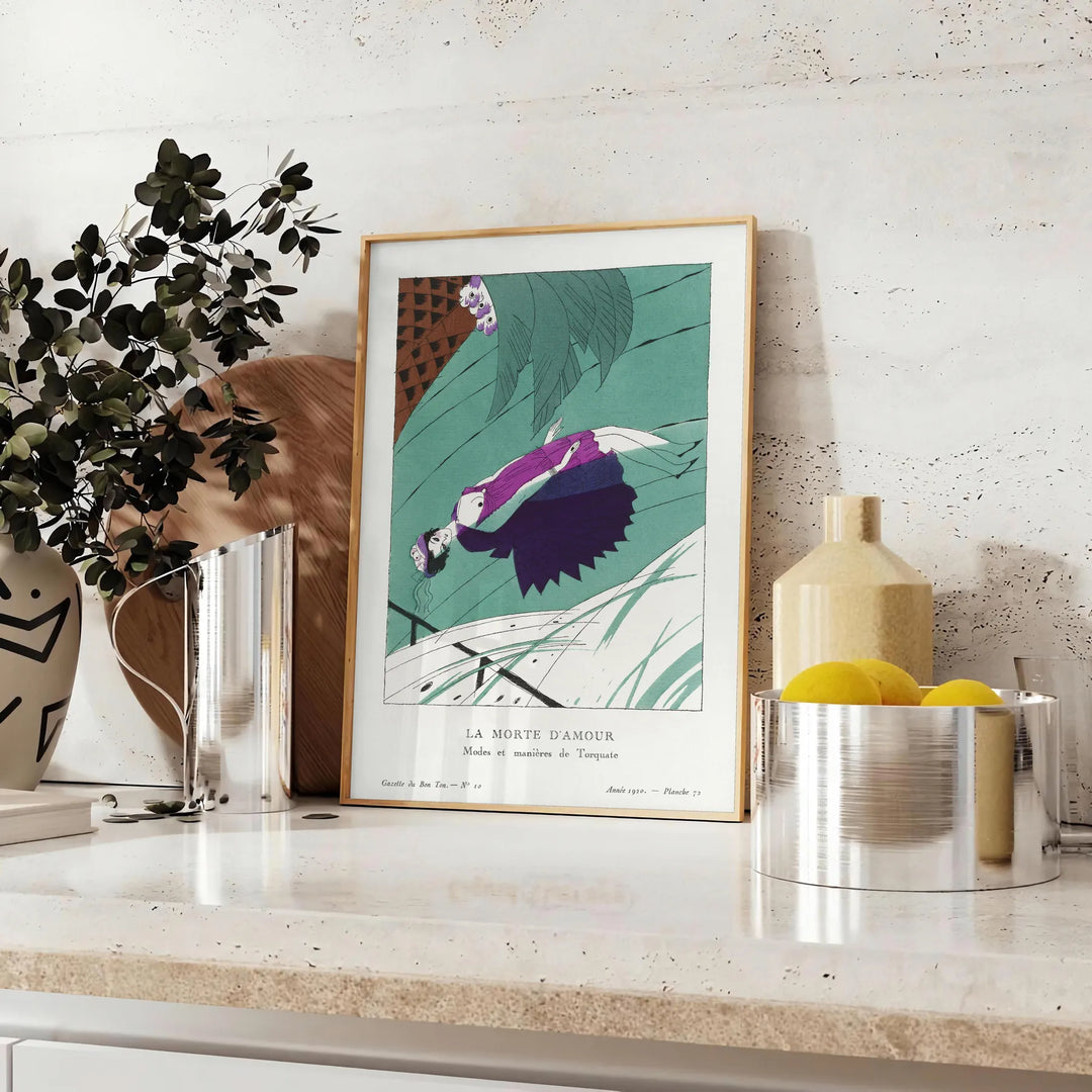 Vintage illustration of La Morte d'Amour with soft blue and gray tones - styled on a counter with eucalyptus and a bowl of lemons