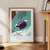 Vintage illustration of La Morte d'Amour with soft blue and gray tones - beside a round wooden side table with books