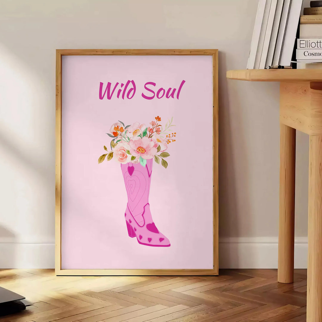 abstract depiction of a wild soul with gray and orange tones - beside a round wooden side table with books