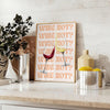 A playful kitchen poster featuring the phrase 'Wine Not' in bold letters, with yellow and purple colors. - styled on a counter with eucalyptus and a bowl of lemons