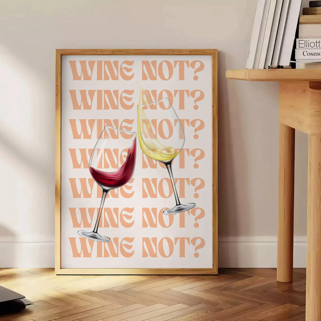 A playful kitchen poster featuring the phrase 'Wine Not' in bold letters, with yellow and purple colors. - beside a round wooden side table with books