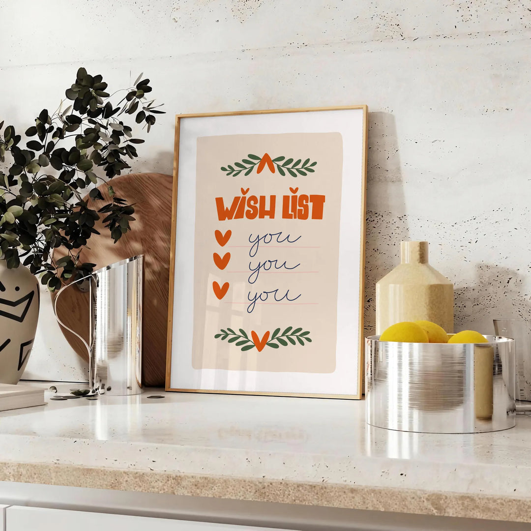 A minimalist poster featuring a wish list in gray and green tones - styled on a counter with eucalyptus and a bowl of lemons