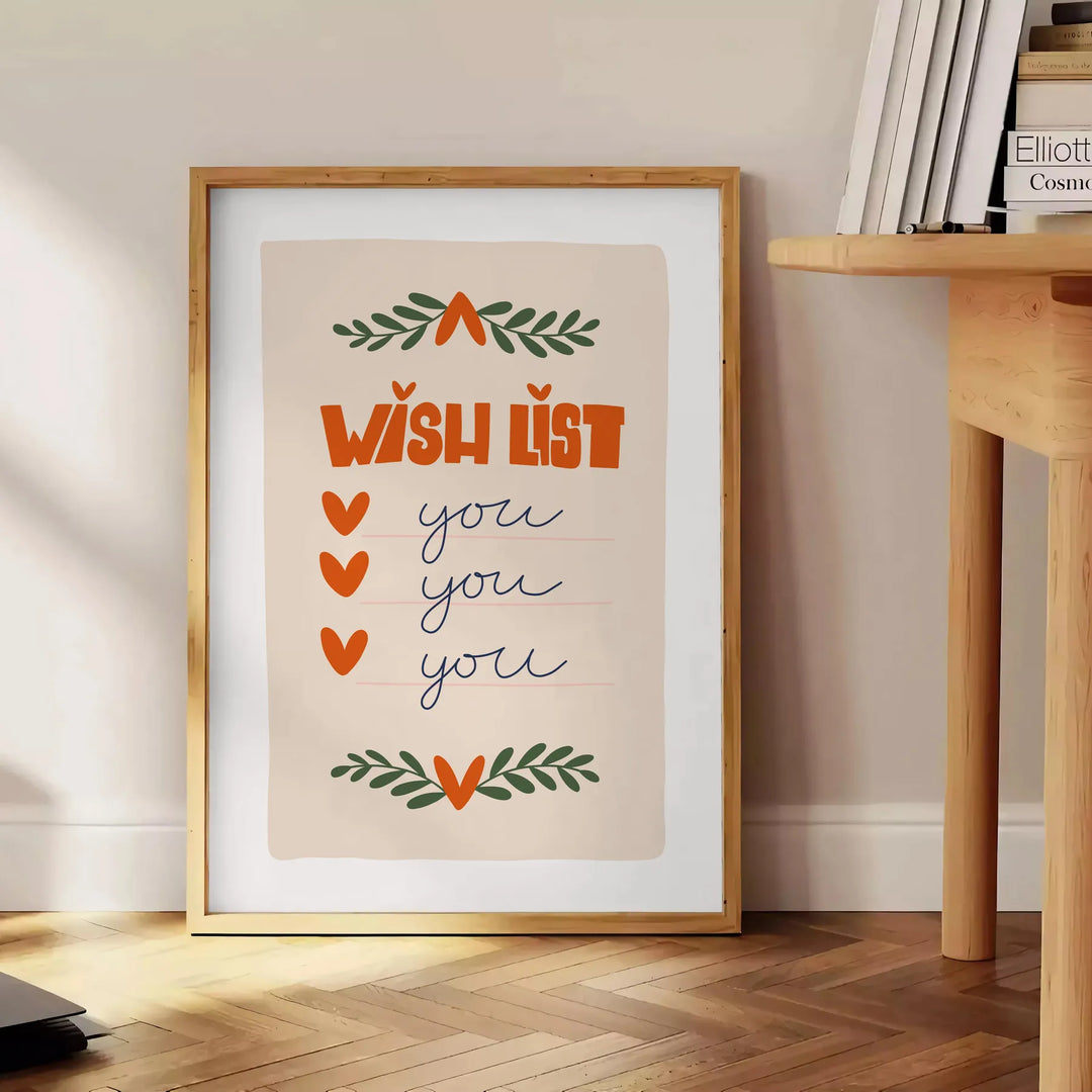 A minimalist poster featuring a wish list in gray and green tones - beside a round wooden side table with books