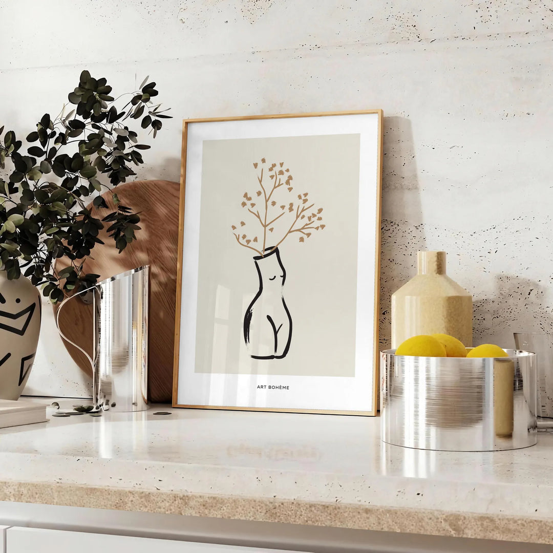 Silhouette of a woman in bohemian style against gray and black background - styled on a counter with eucalyptus and a bowl of lemons