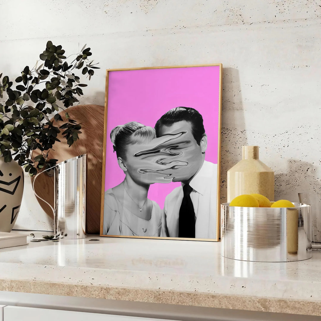 A pink and purple abstract artwork featuring a woman and a man - styled on a counter with eucalyptus and a bowl of lemons