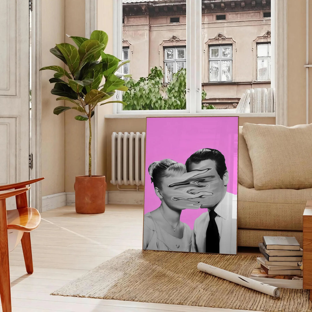 A pink and purple abstract artwork featuring a woman and a man - in a Parisian living room with a sofa and a fig plant