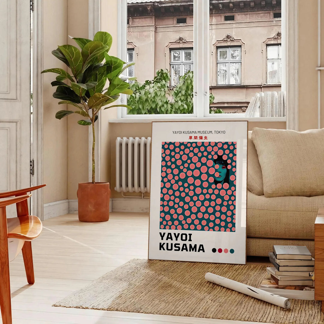 Abstract polka dot pattern in green and orange by Yayoi Kusama - in a Parisian living room with a sofa and a fig plant