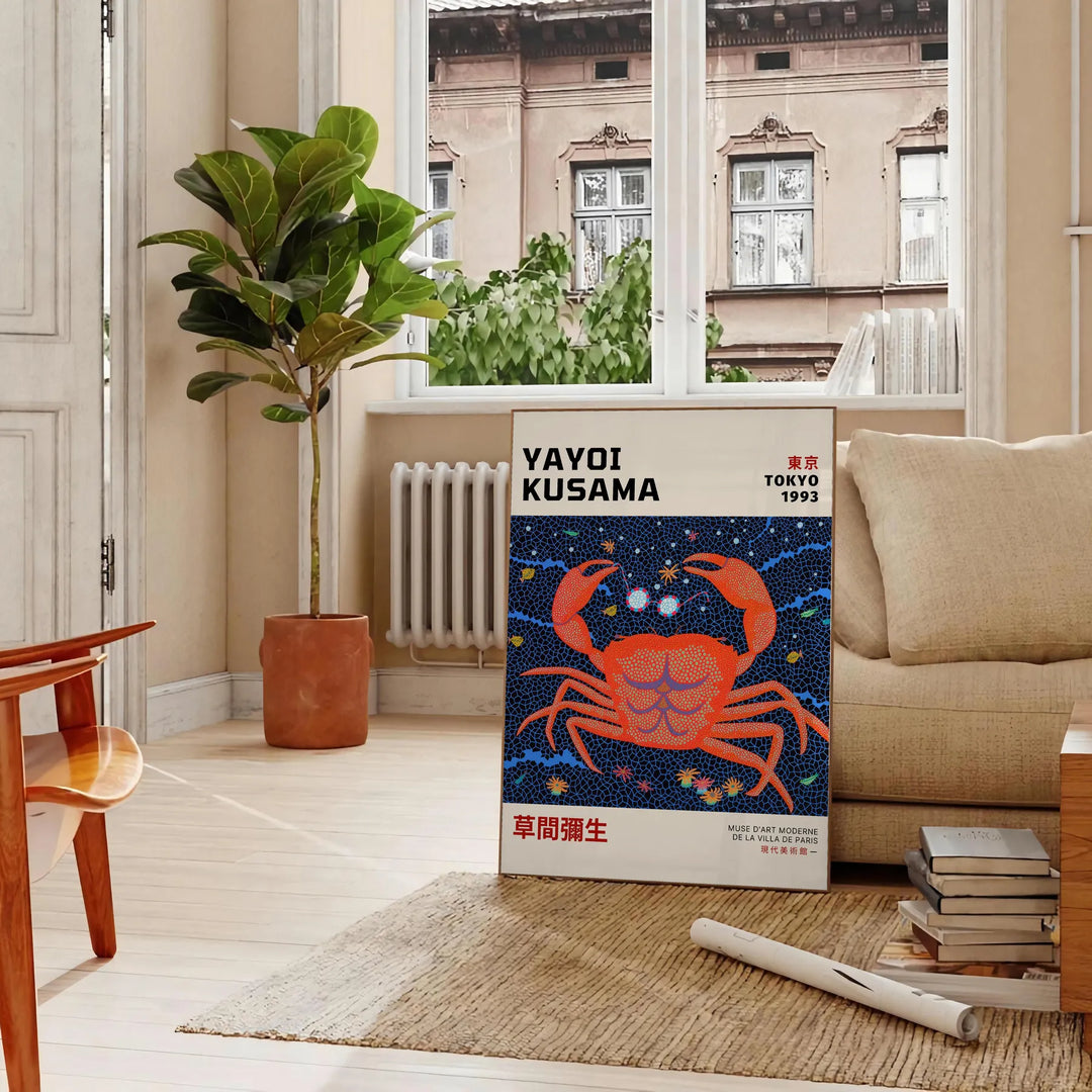Abstract polka dot patterns in orange and blue by Yayoi Kusama - in a Parisian living room with a sofa and a fig plant
