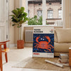 Abstract polka dot patterns in orange and blue by Yayoi Kusama - in a Parisian living room with a sofa and a fig plant
