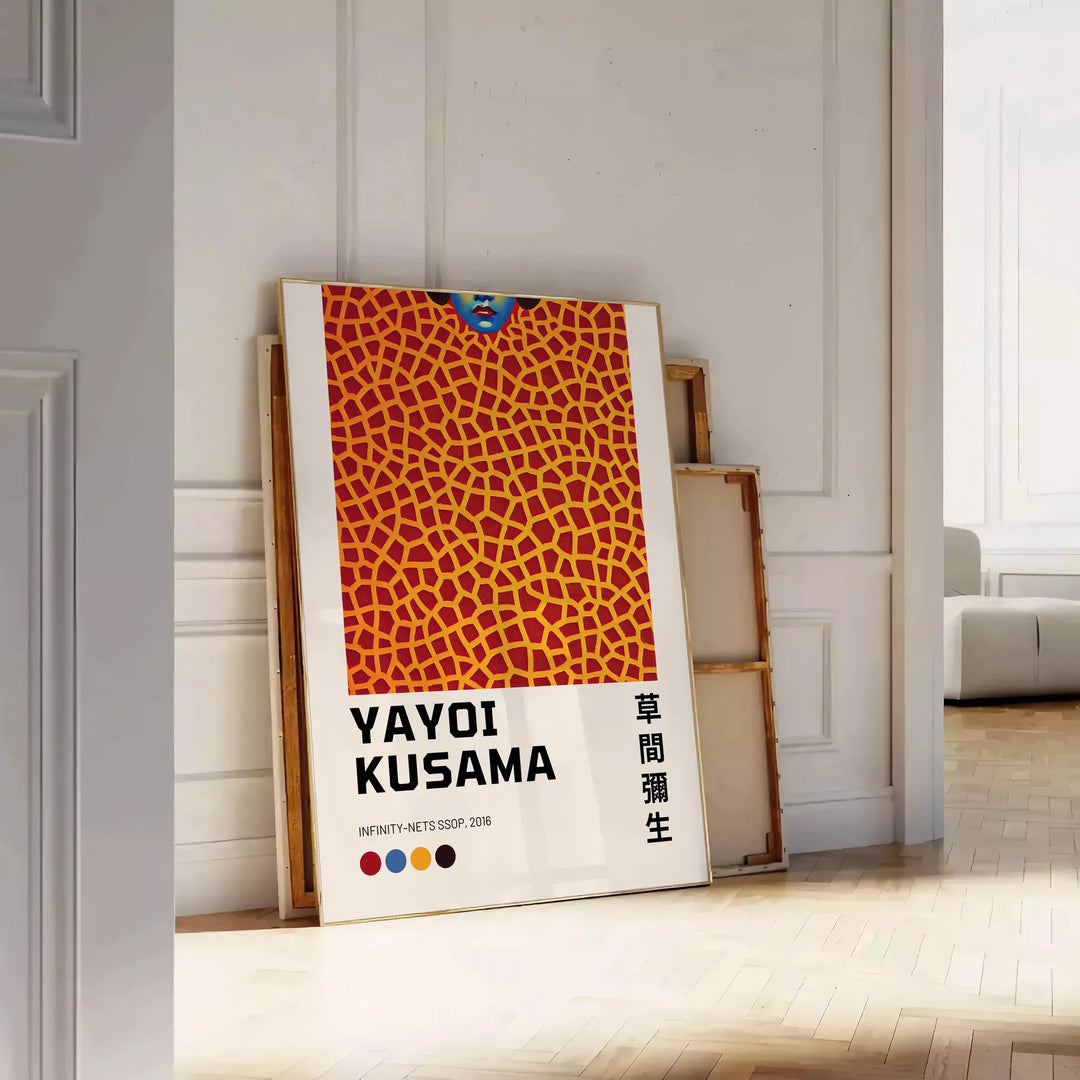 Abstract polka dot patterns in black and orange by Yayoi Kusama - leaning on a herringbone floor against a white panelled wall