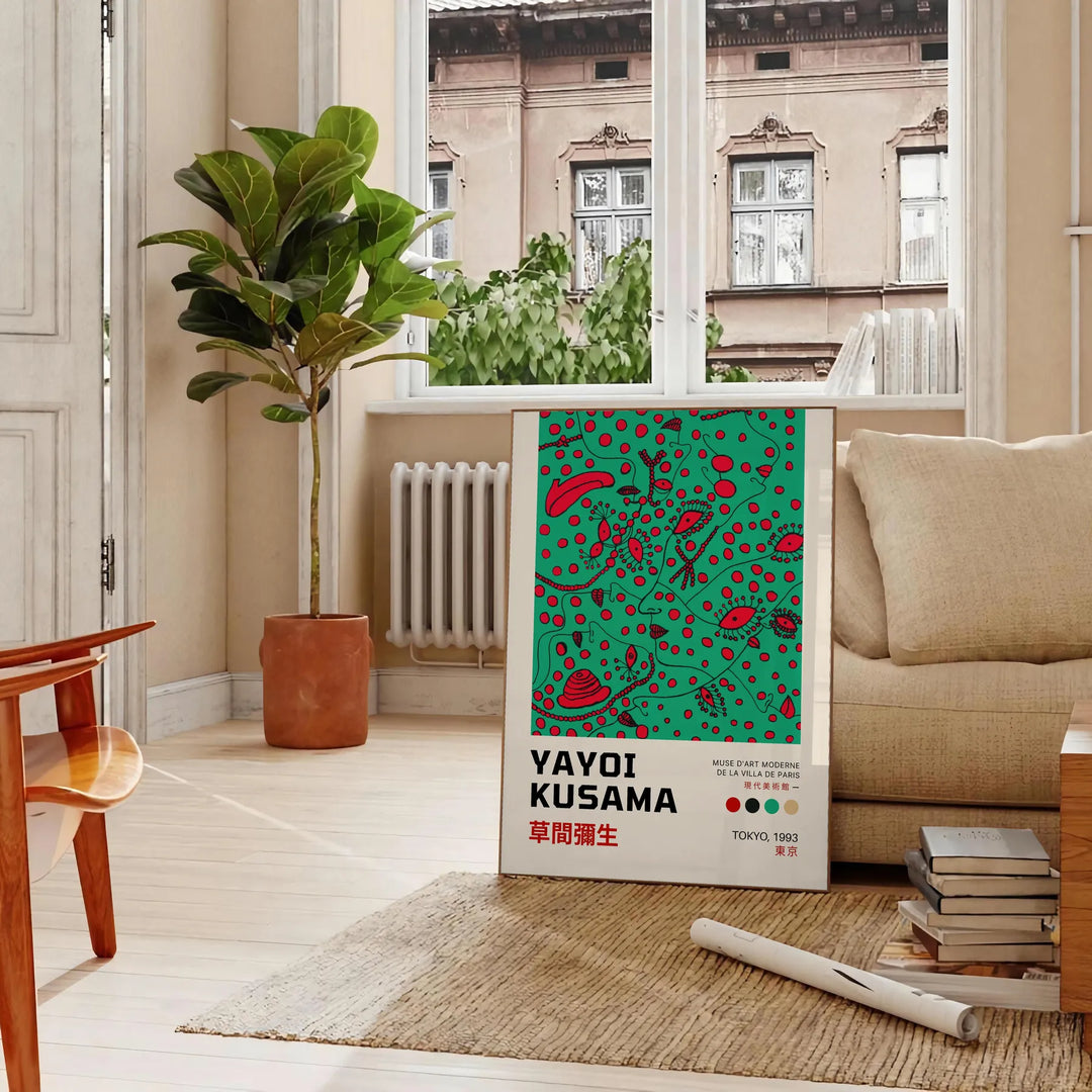 Abstract polka dot patterns in black and blue by Yayoi Kusama - in a Parisian living room with a sofa and a fig plant