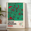 Abstract polka dot patterns in black and blue by Yayoi Kusama - in a bright minimalist room with a plant and an armchair