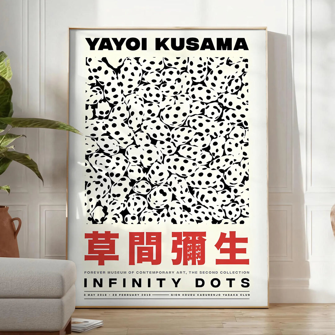 Abstract polka dot patterns in orange and black by Yayoi Kusama - in a bright minimalist room with a plant and an armchair