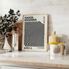 Black and white polka dot patterns with abstract shapes by Yayoi Kusama - styled on a counter with eucalyptus and a bowl of lemons