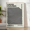 Black and white polka dot patterns with abstract shapes by Yayoi Kusama - in a bright minimalist room with a plant and an armchair