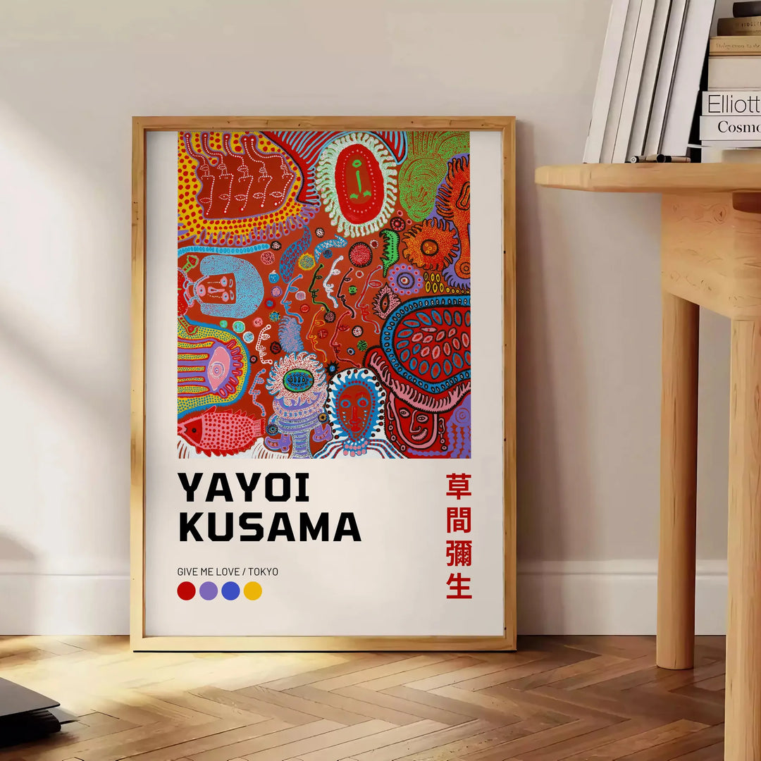 Colorful polka dots in green and orange by Yayoi Kusama - beside a round wooden side table with books