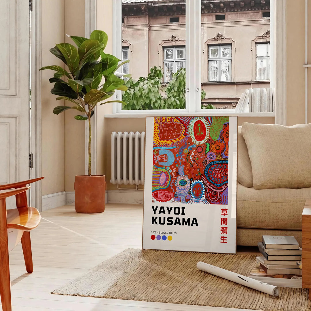 Colorful polka dots in green and orange by Yayoi Kusama - in a Parisian living room with a sofa and a fig plant