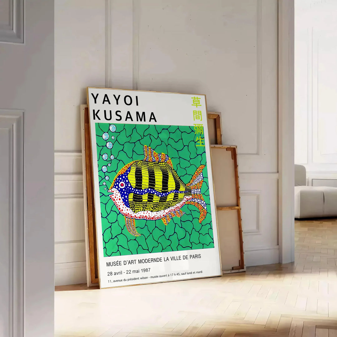 Colorful polka dots on a black background in Yayoi Kusama's signature style - leaning on a herringbone floor against a white panelled wall